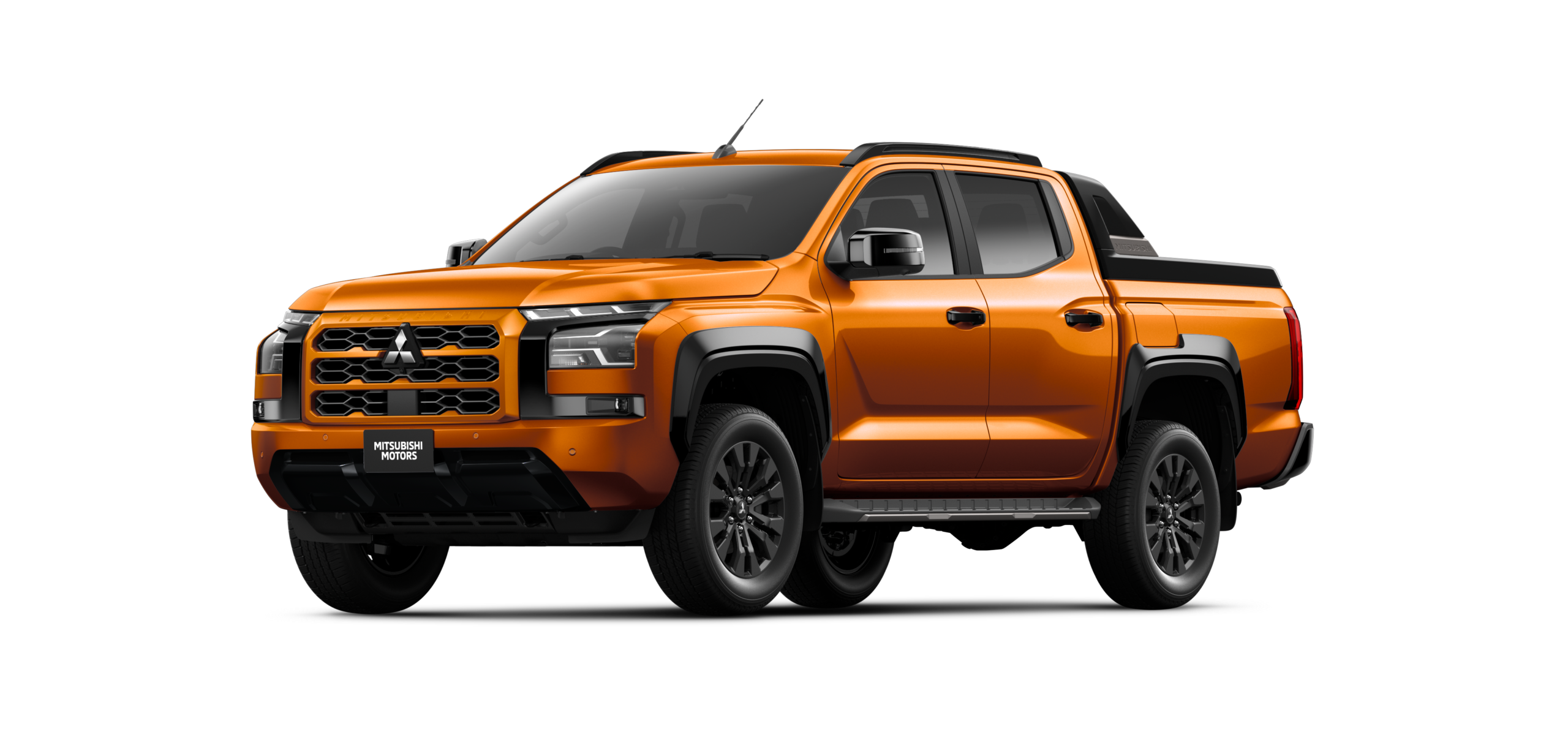 Mitsubishi L200 in orange, front three-quarter view