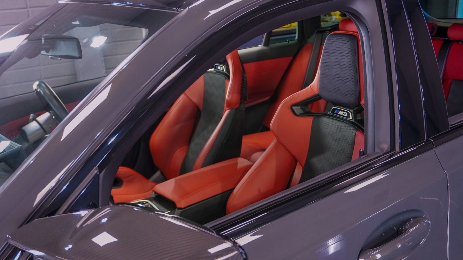 A car being professionally prepared before sale