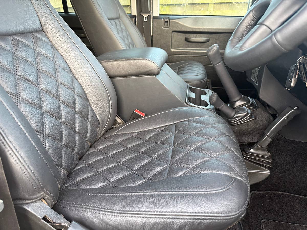 Black quilted leather seating in a finished Defender