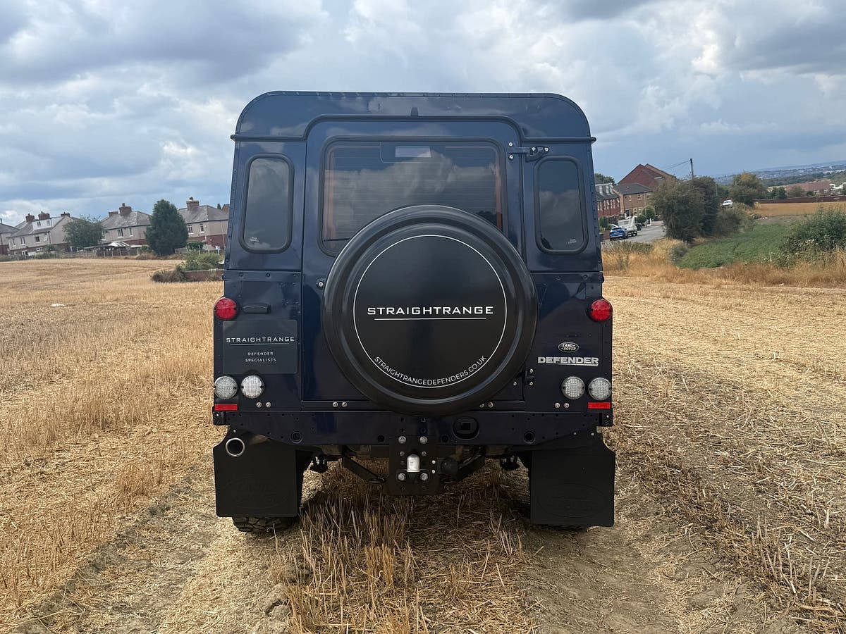 Close detail of the wheel, arch and sill of a finished Defender